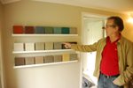 man pointing to multi color concrete countertop samples