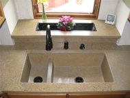 custom concrete sink and windowsill in kitchen