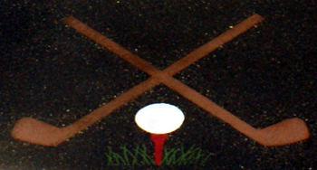 closeup of golf clubs and ball in custom concrete countertop with color embedded Impact golf shop in Minnesota