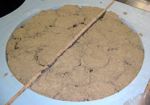 tan concrete in round mold made of blue foam for concrete table top