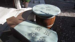 custom concrete table and bench shaped like boot
