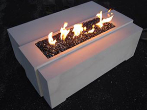 ridge design concrete fire pit in white with black fire glass