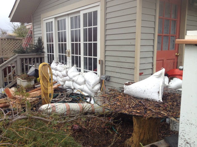 back of house with sandbags after flooding
