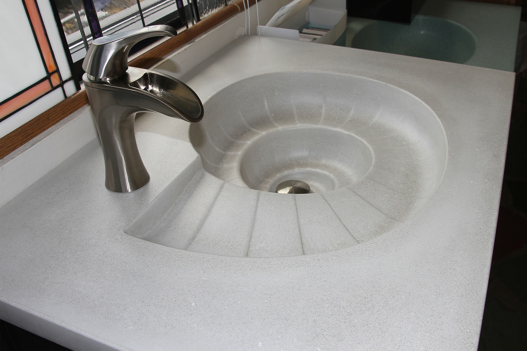 custom concrete sink shaped like conch shell