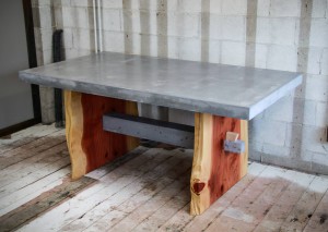 gray concrete table top with live edge wood legs