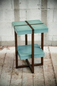 small green concrete table with shelf and metal legs