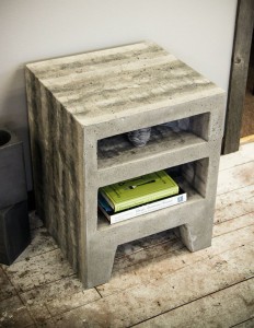 small solid cast concrete table with shelves