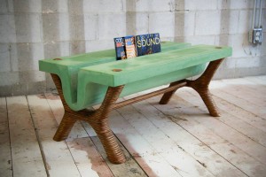 green concrete table magazine holder with striped wood legs