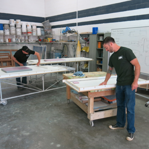 two men in concrete countertop shop with forms