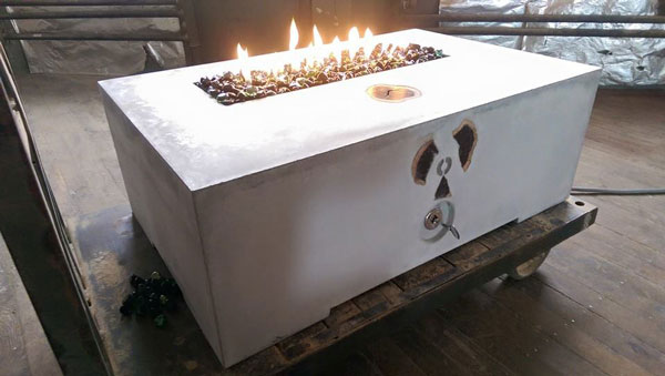 white concrete fire pit with geode slices embedded