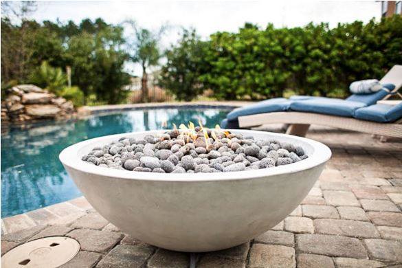 concrete fire bowl on pool deck