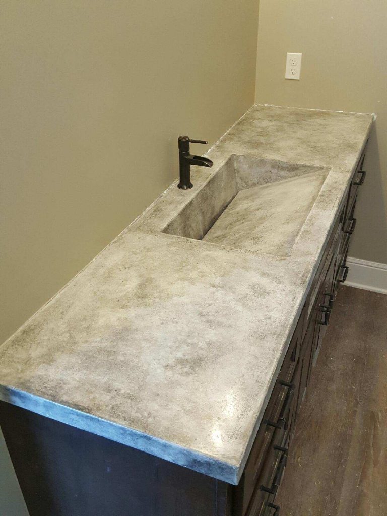 long concrete vanity with integral ramp concrete sink